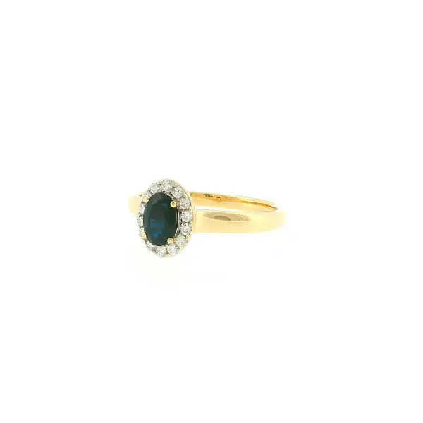 Gold ring with 0.50 ct sapphire in a diamond halo